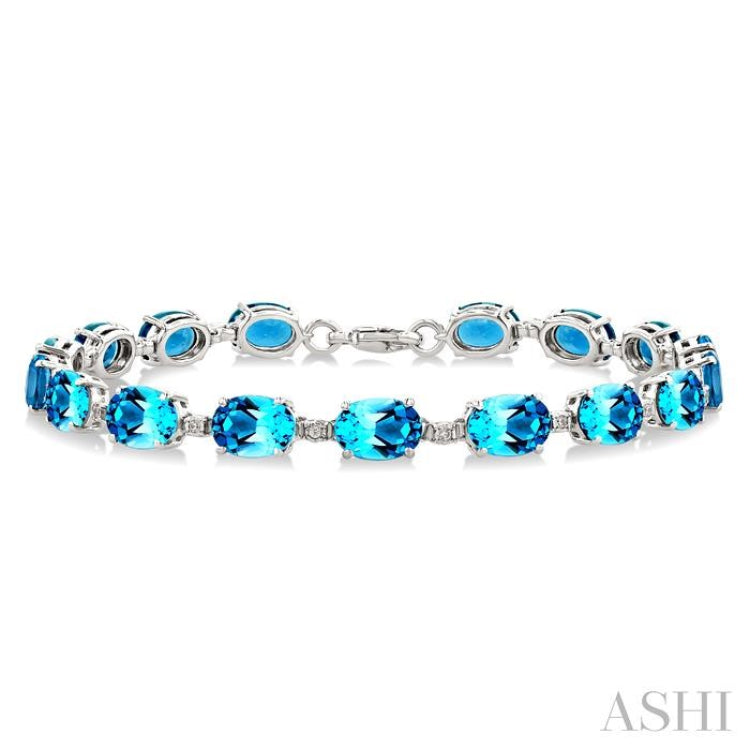7X5 MM Oval Shape Blue Topaz and 1/10 Ctw Single Cut Diamond Semi-Precious Bracelet in Sterling Silver