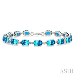 7X5 MM Oval Shape Blue Topaz and 1/10 Ctw Single Cut Diamond Semi-Precious Bracelet in Sterling Silver