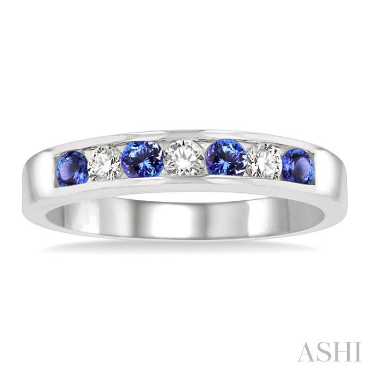 2.5 MM Round Cut Tanzanite and 1/5 Ctw Channel Set Round Cut Diamond Band in 14K White Gold
