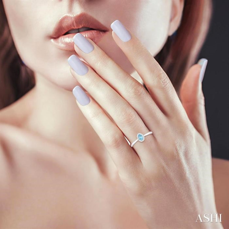 5x3 MM Oval Shape Aquamarine and 1/20 Ctw Round Cut Diamond Halo Semi-Precious Ring in 10K White Gold