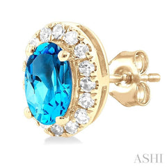 5x3 MM Oval Shape Blue Topaz and 1/8 Ctw Round Cut Diamond Halo Semi-Precious Stud Earrings in 14K Yellow Gold