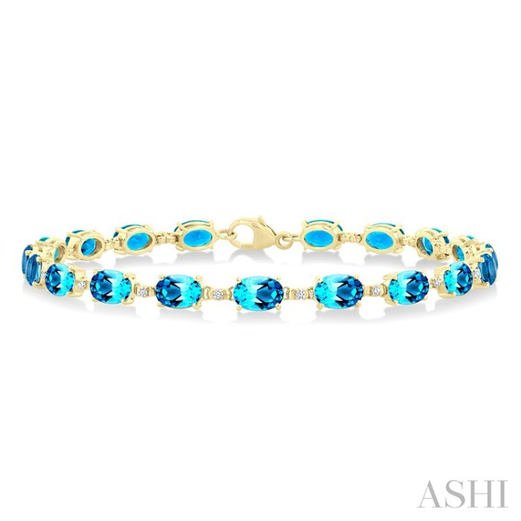 6X4 MM Oval Cut Blue Topaz and 1/6 Ctw Round Cut Diamond Semi-Precious Tennis Bracelet in 10K Yellow Gold