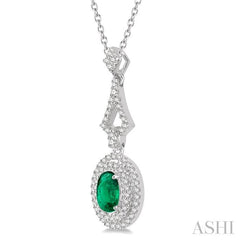 6X4 MM Oval Shape Emerald and 1/5 Ctw Round Cut Diamond Precious Pendant With Chain in 14K White Gold