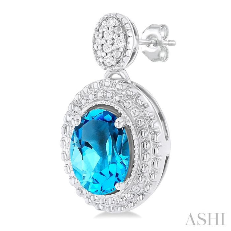 7X5 MM Oval Cut Blue Topaz and 1/20 Ctw Round Cut Diamond Semi-Precious Earring in Sterling Silver